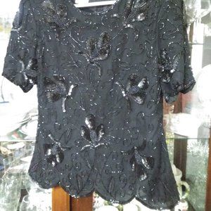 black formal sequenced top